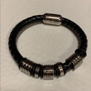 Black leather men’s bracelet with silver accents